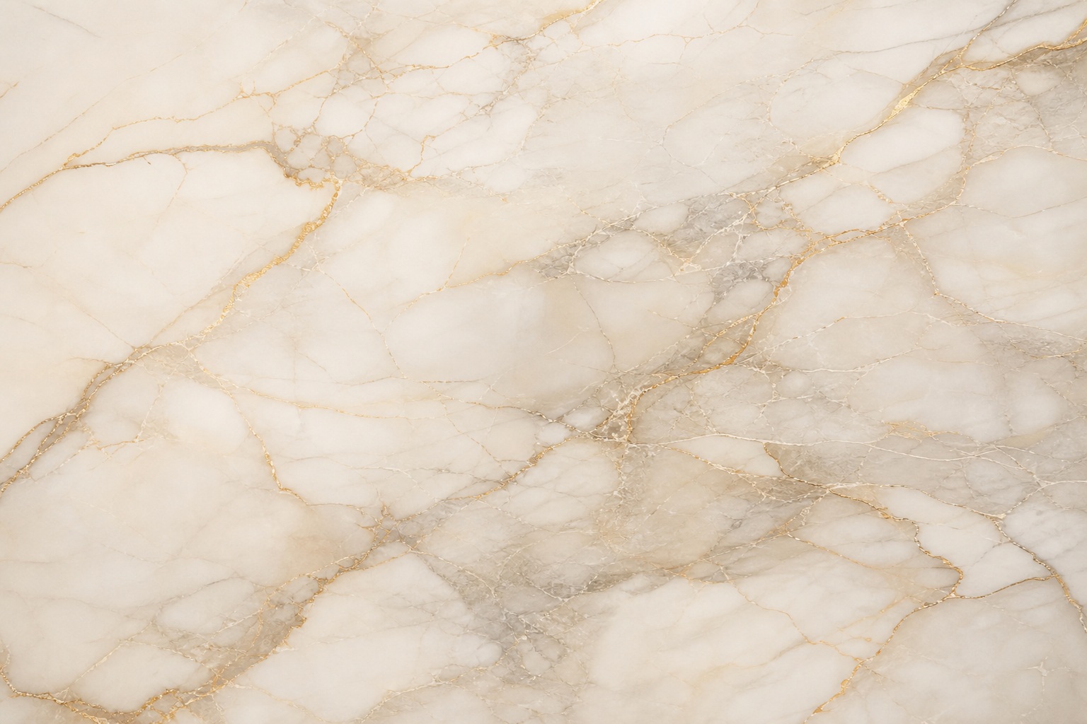 Light marble surface with soft beige and gold veining across a neutral background.