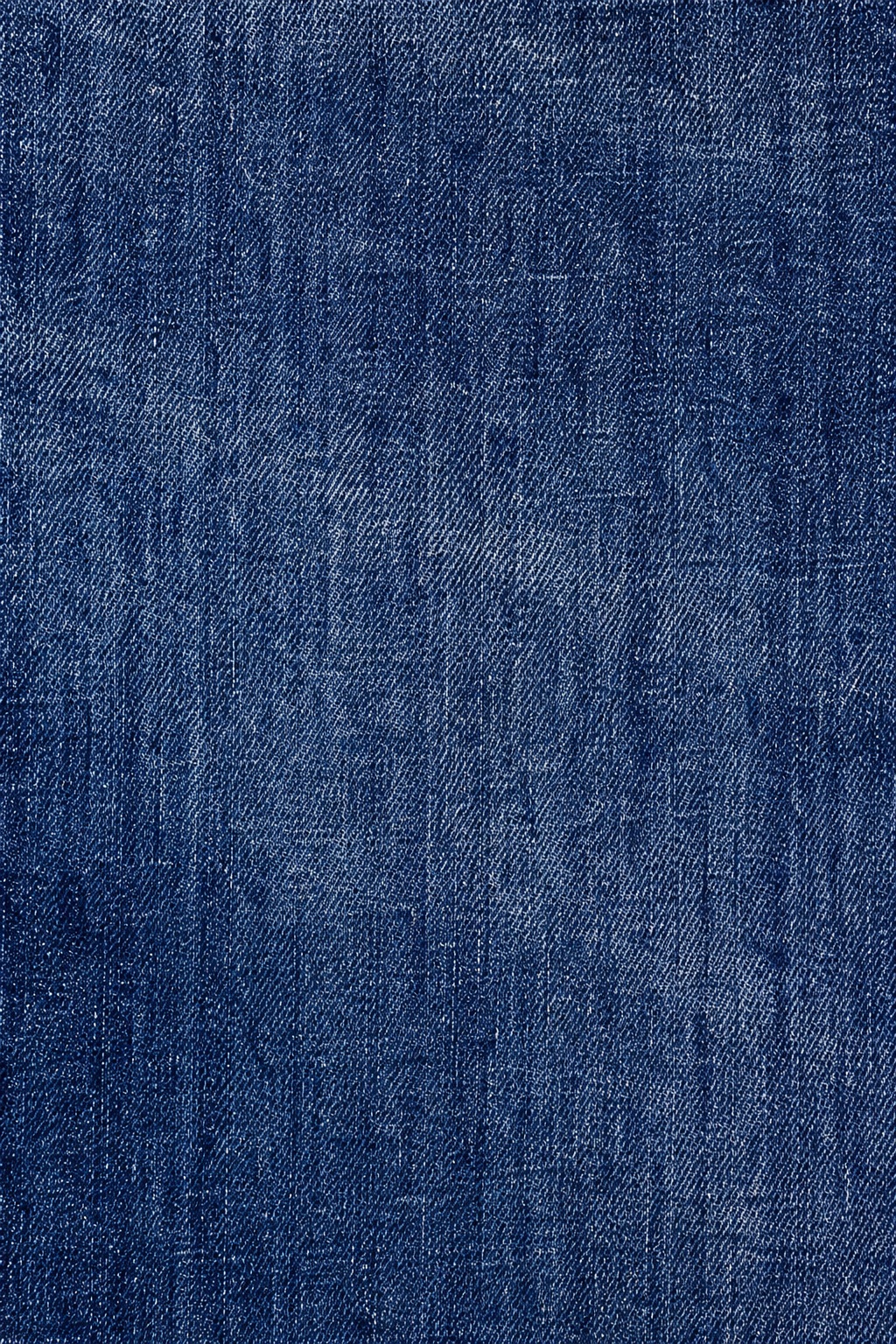Blue denim fabric texture with a woven, slightly faded surface