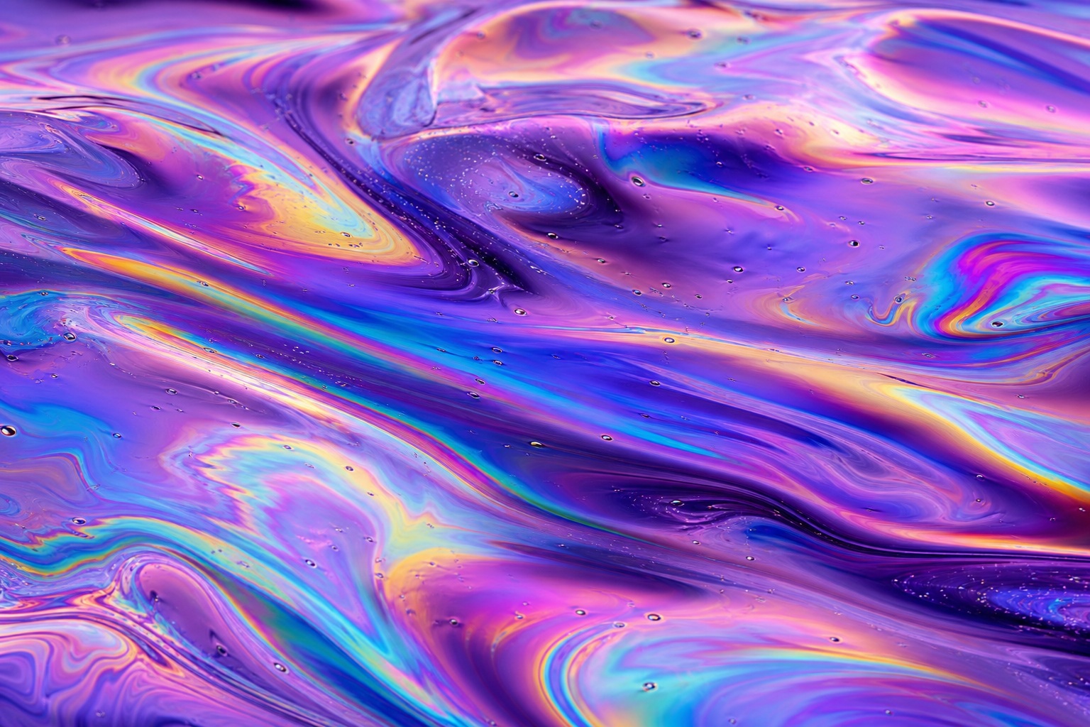 Abstract violet, pink, and blue iridescent oil slick texture with flowing shimmer.
