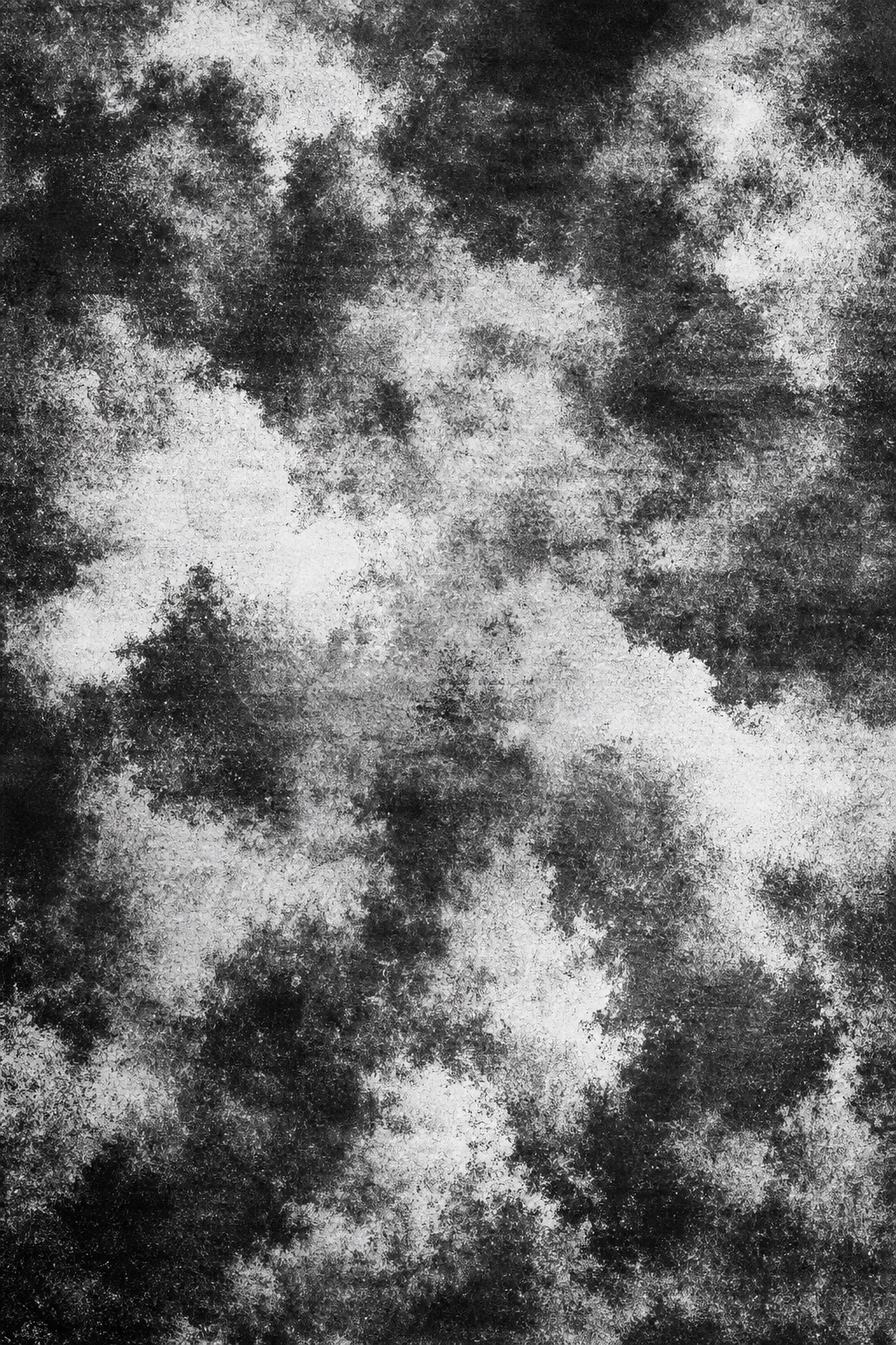 Black and white mottled charcoal photocopy texture with cloudy grain patterns