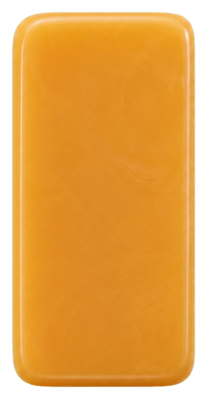 A glossy butterscotch-colored resin domino blank with rounded corners.