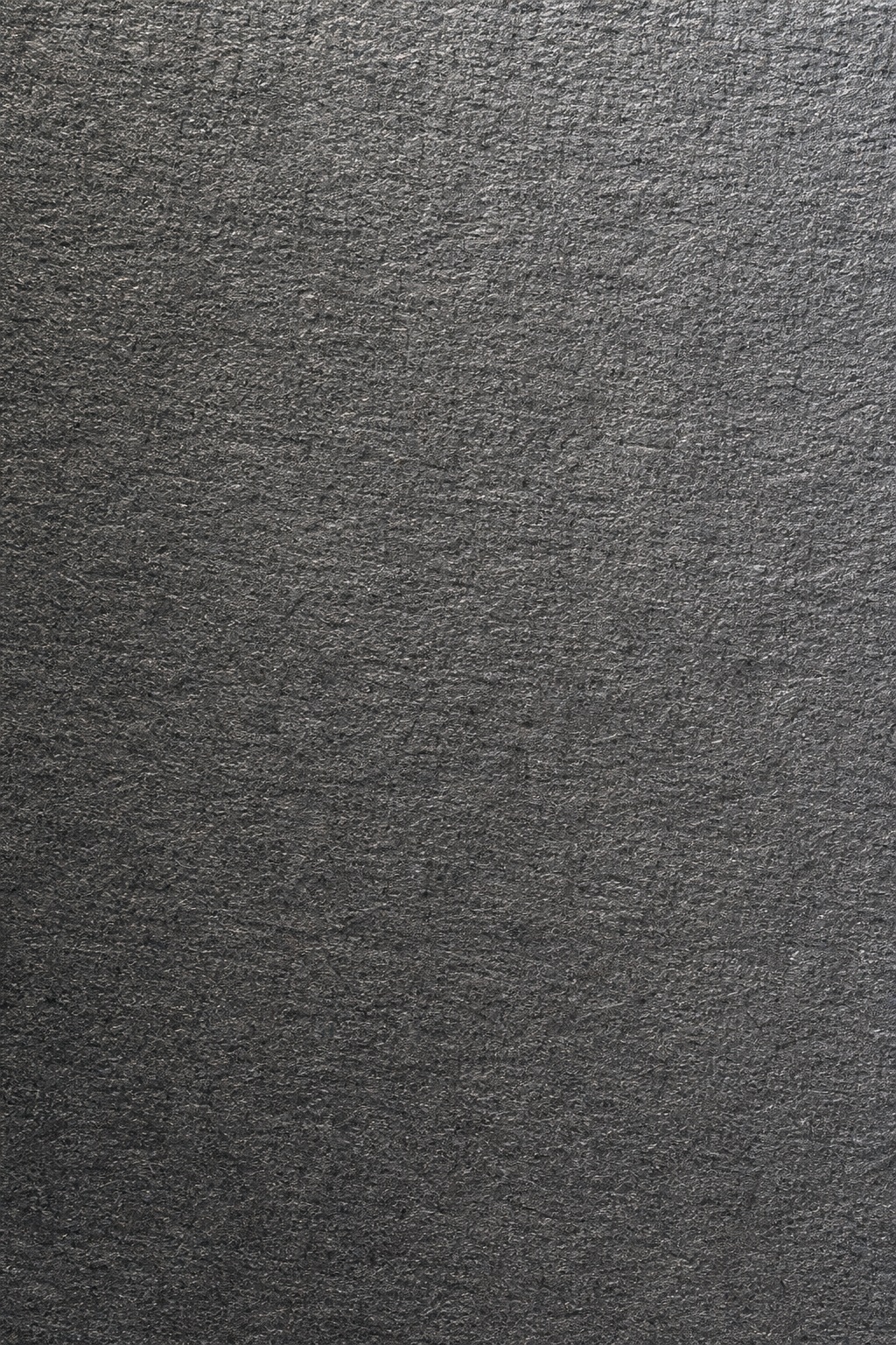 Dark charcoal gray embossed paper texture with fine crossgrain fibers.