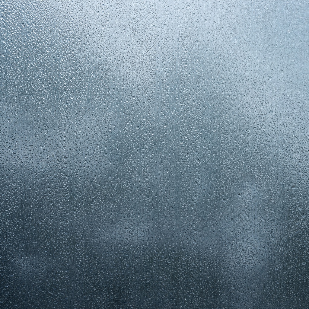 Blue-gray textured glass surface with fine etched rain-like speckling