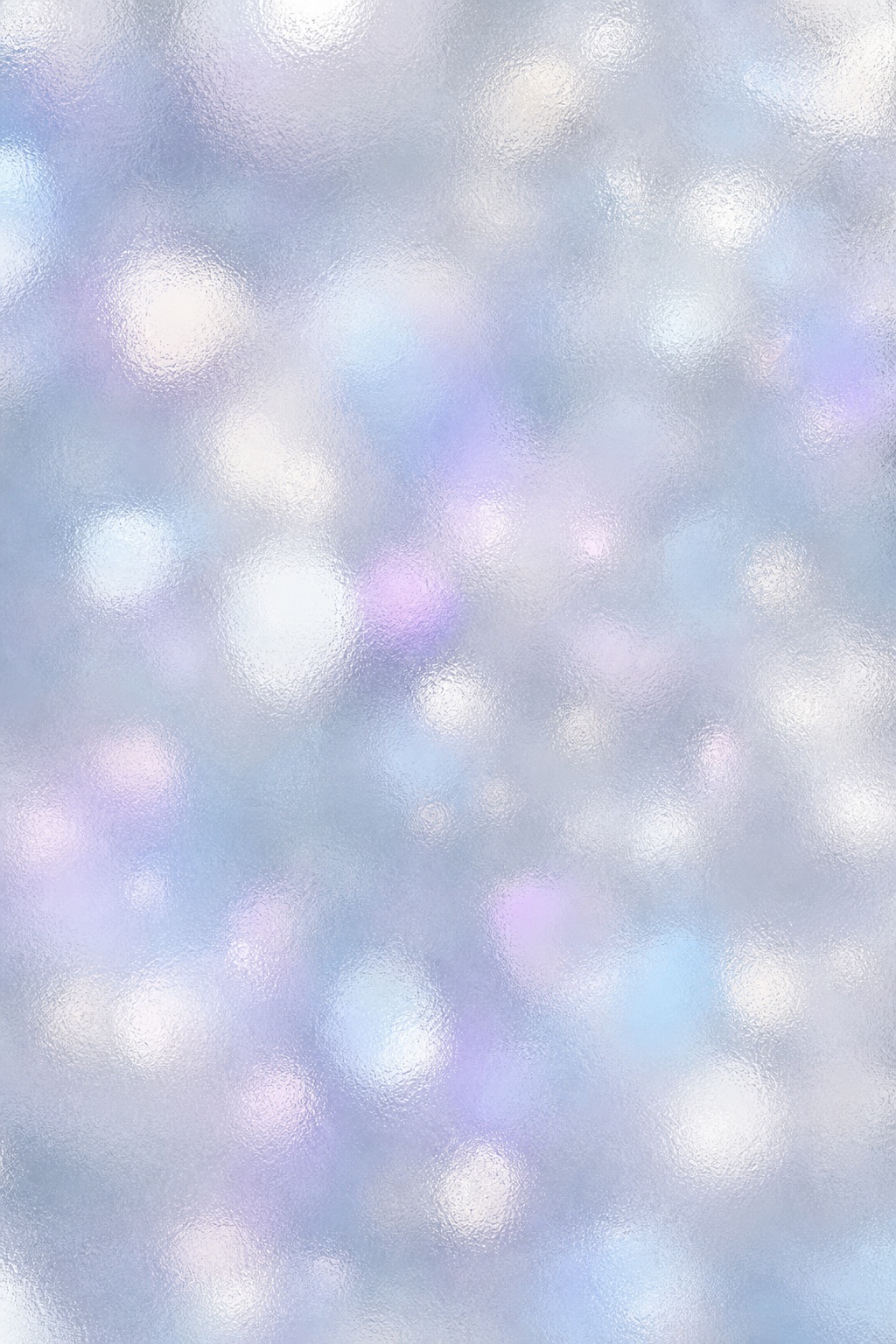 Soft blurred bokeh lights in cool neutral pastel tones