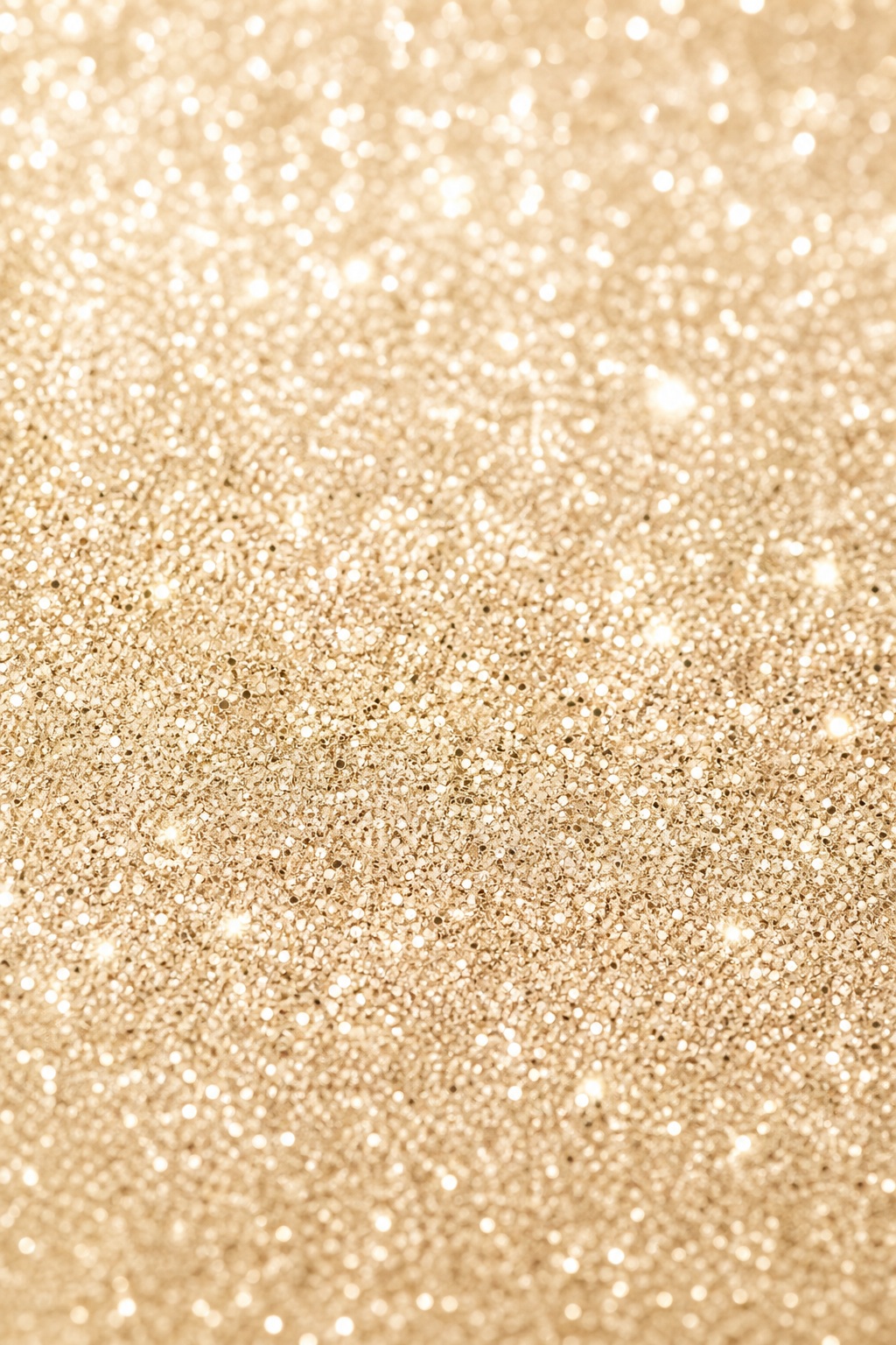 Vertical champagne gold glitter texture with dense sparkling highlights