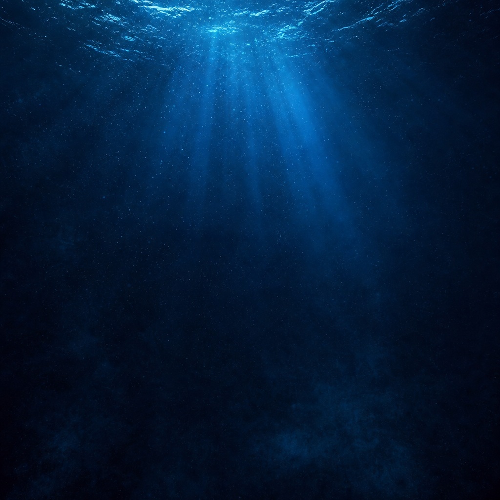Blue underwater scene with light rays filtering through dark ocean water