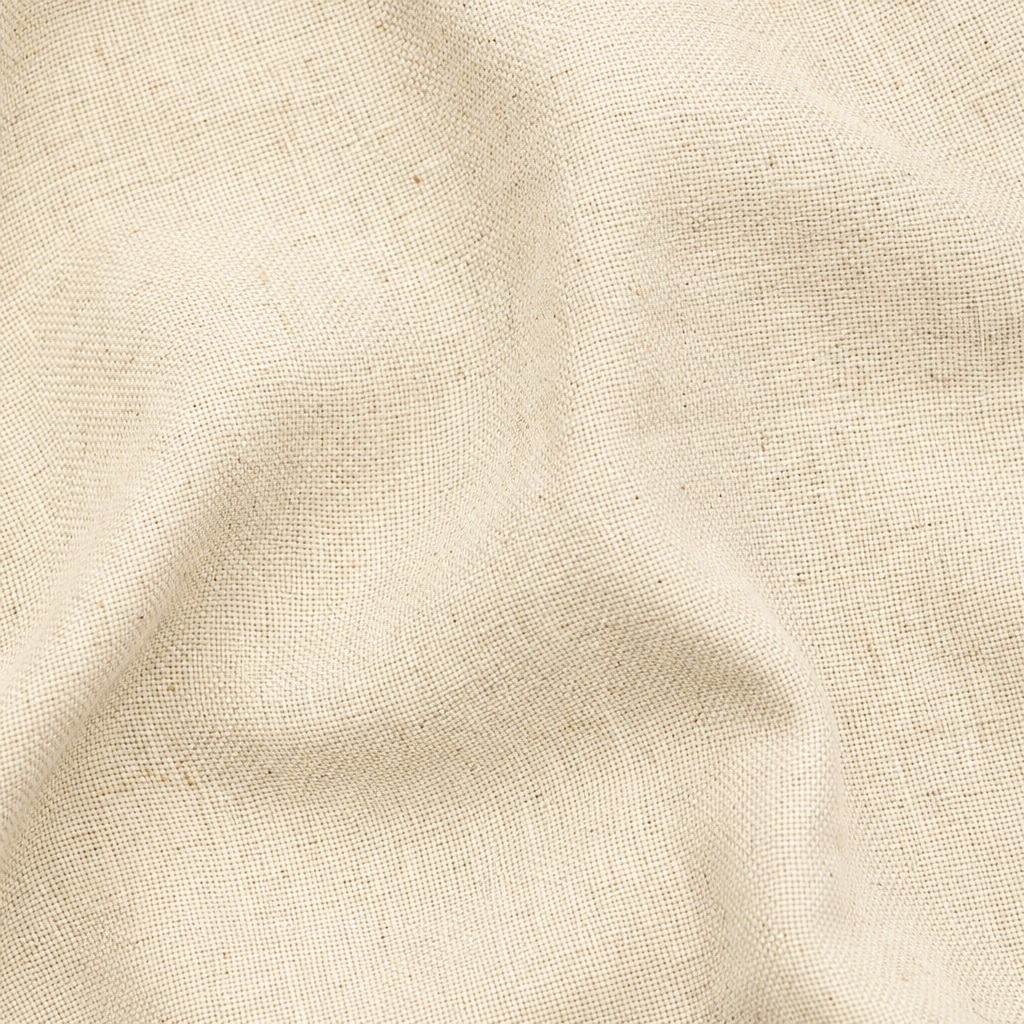 Close-up of a cream linen fabric texture with soft woven folds.