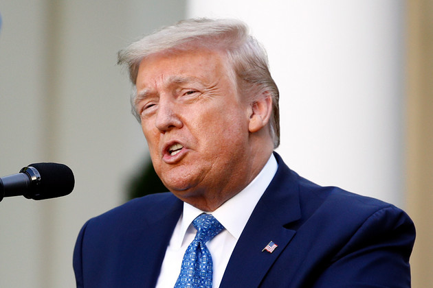 Donald Trump speaking into a microphone