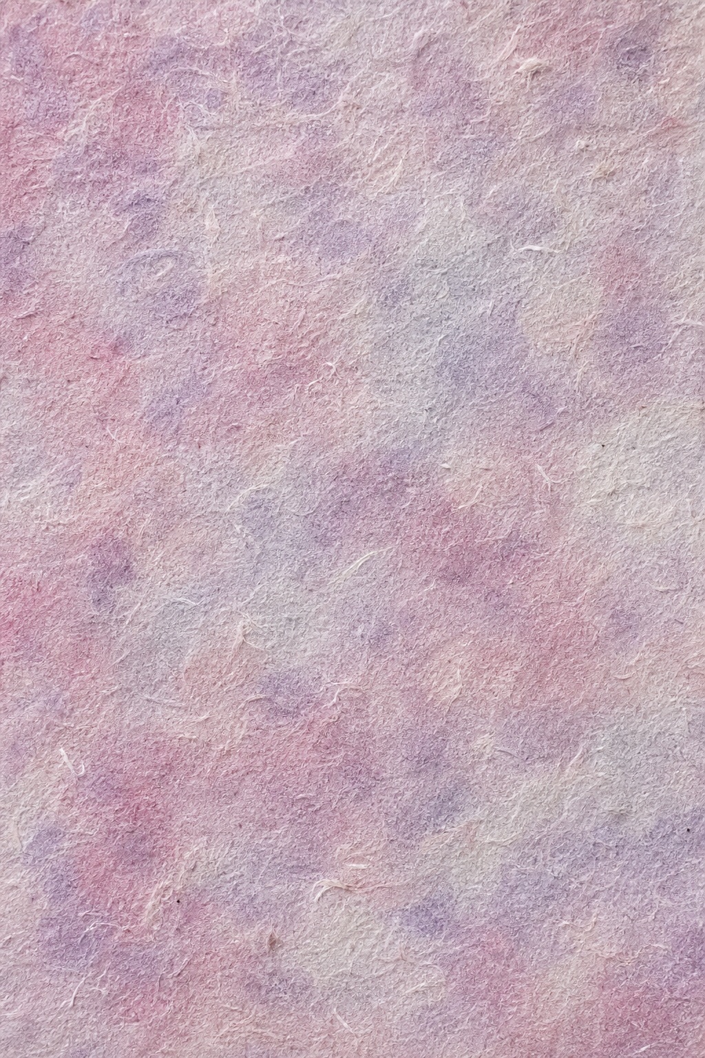 Soft rose lilac handmade paper texture with cloudy fibers and subtle pink-purple mottling