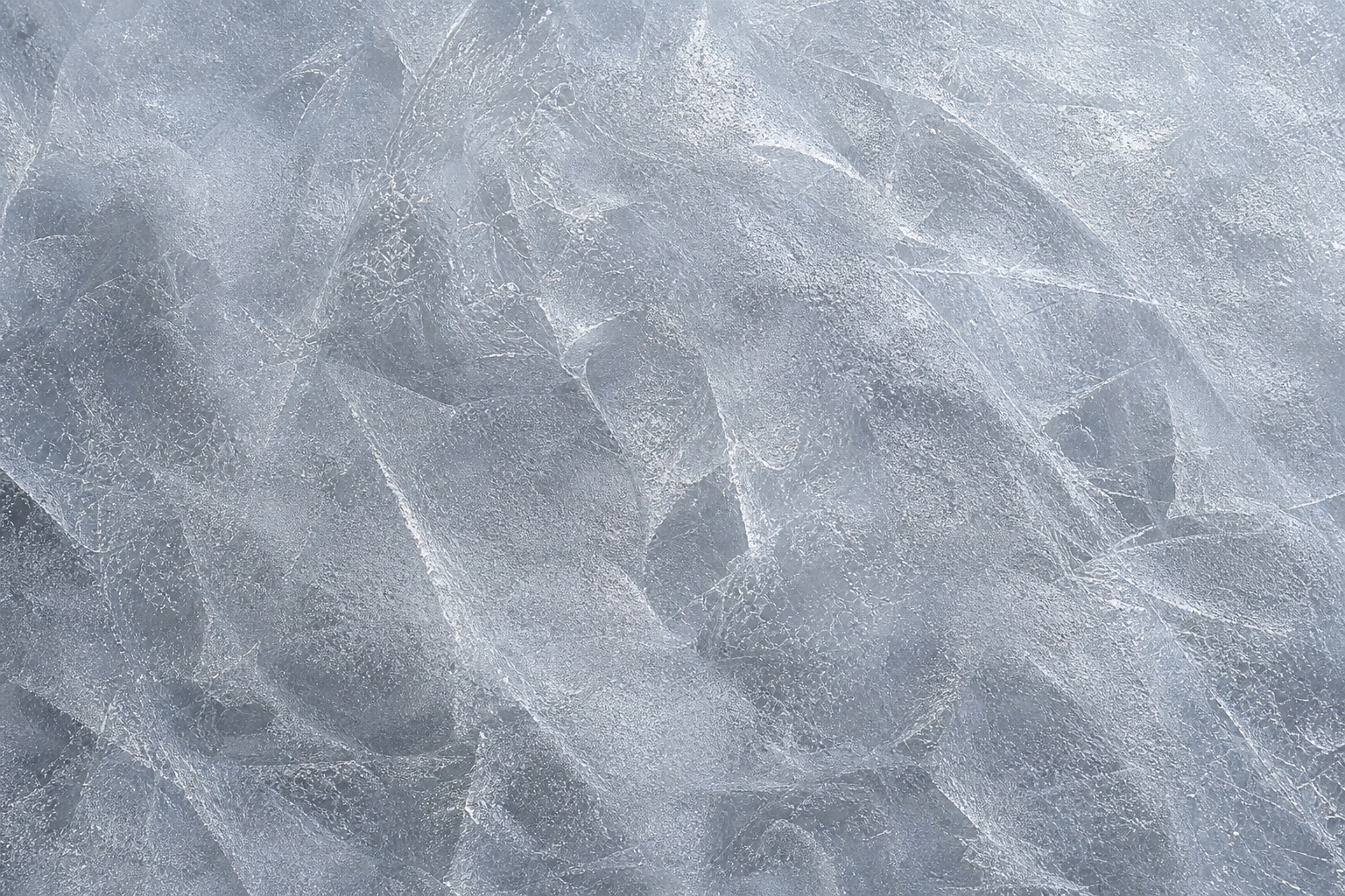 Clear silver frosted ice surface with layered frost patterns and soft texture