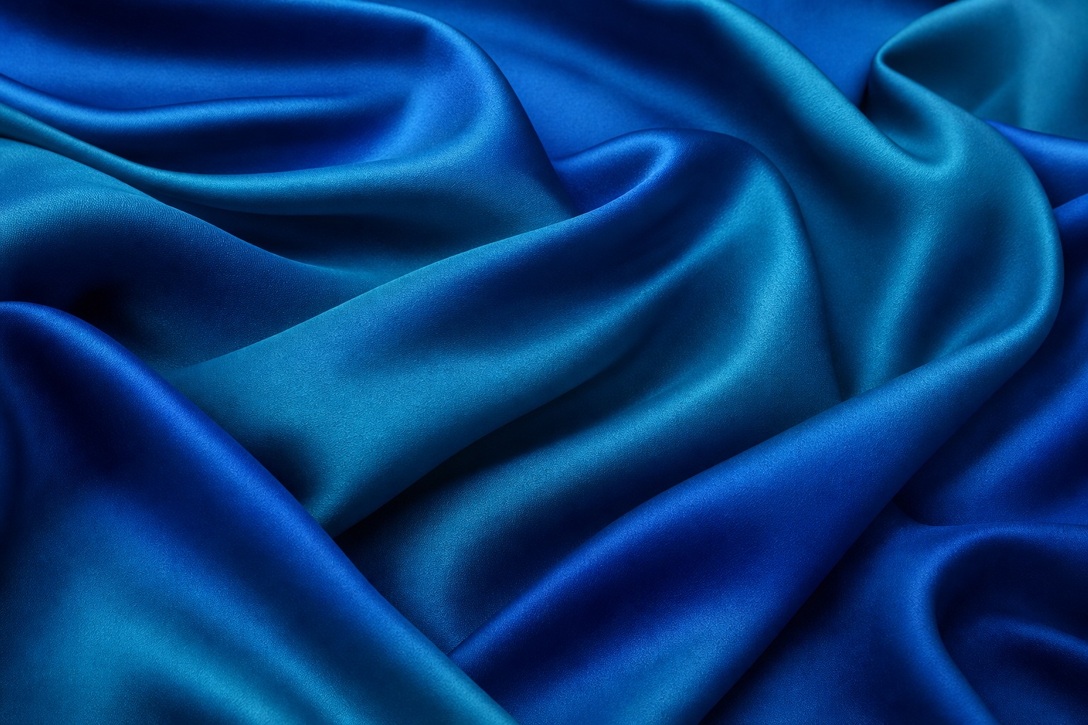 Cobalt teal satin-like fabric with soft folded waves and smooth draped texture