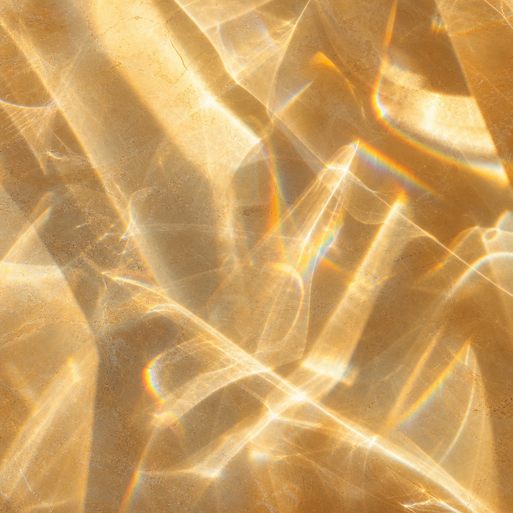 Warm abstract glass refraction pattern with bright caustic light and soft shadows.