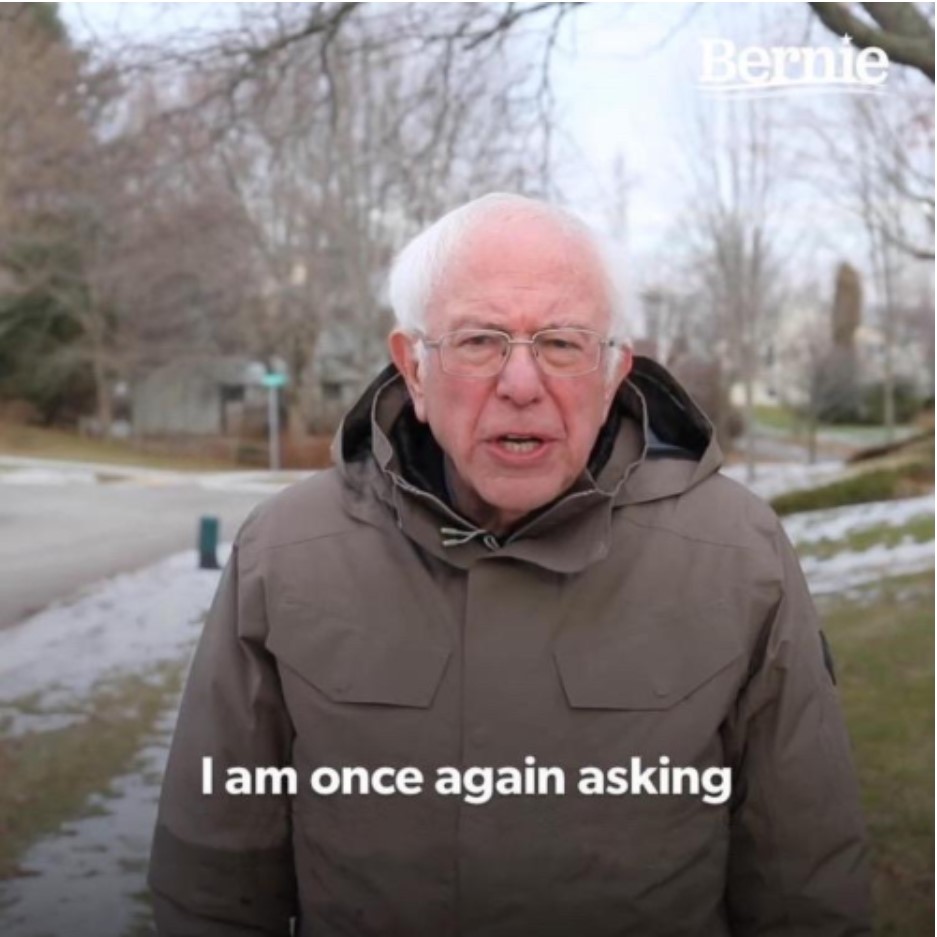 Bernie Sanders standing outdoors in a winter coat with meme-style text overlay.
