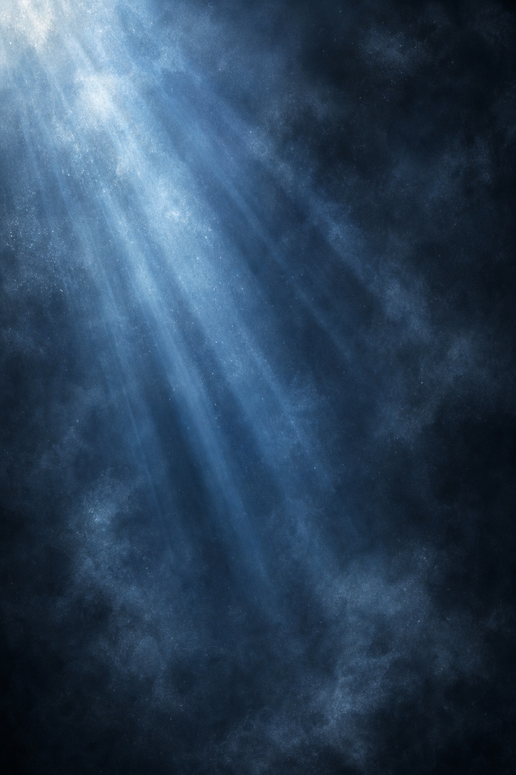 Blue light beams streaming through dusty haze on a dark background