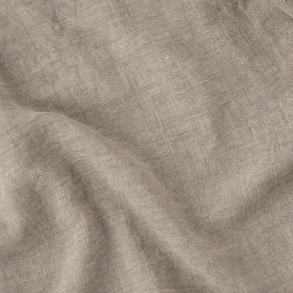 Soft beige linen fabric with gentle folds and woven texture.