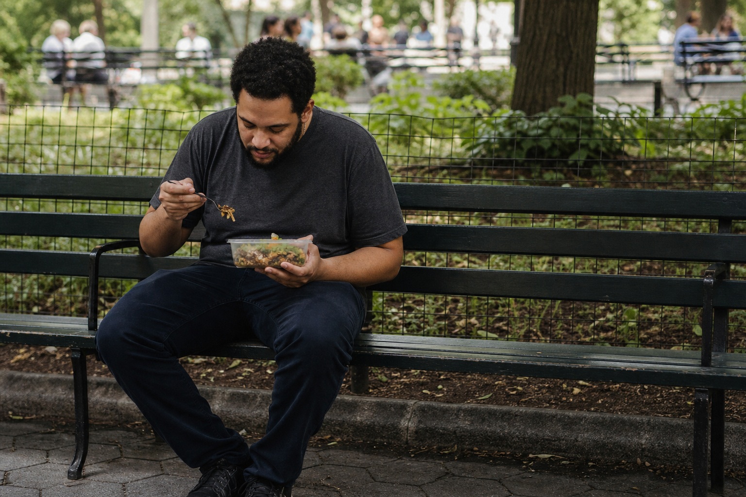 Preview for Man Eating Lunch On Park Bench Stock Background