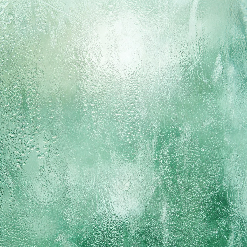 Mint frosted glass texture with soft blurry highlights and icy surface detail