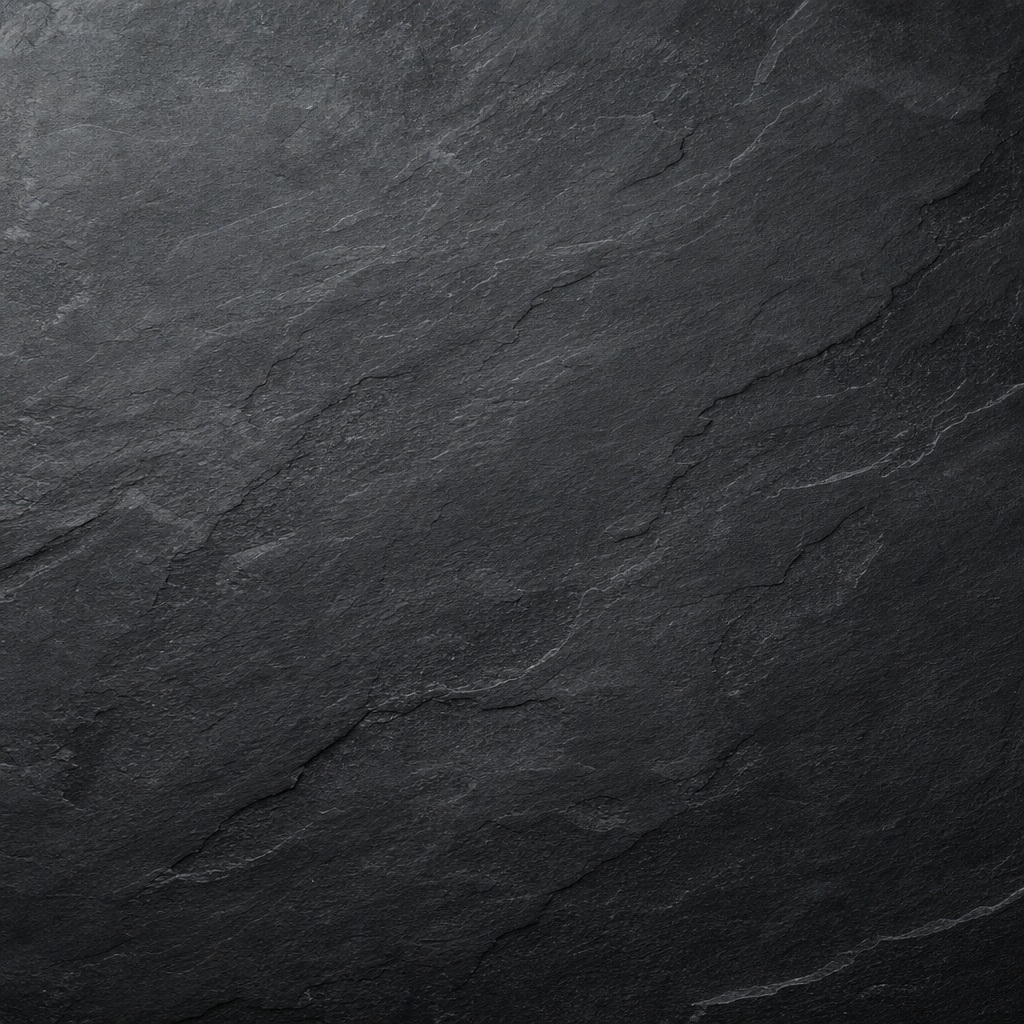 Dark textured stone surface with subtle grain and slate-like layered lines.