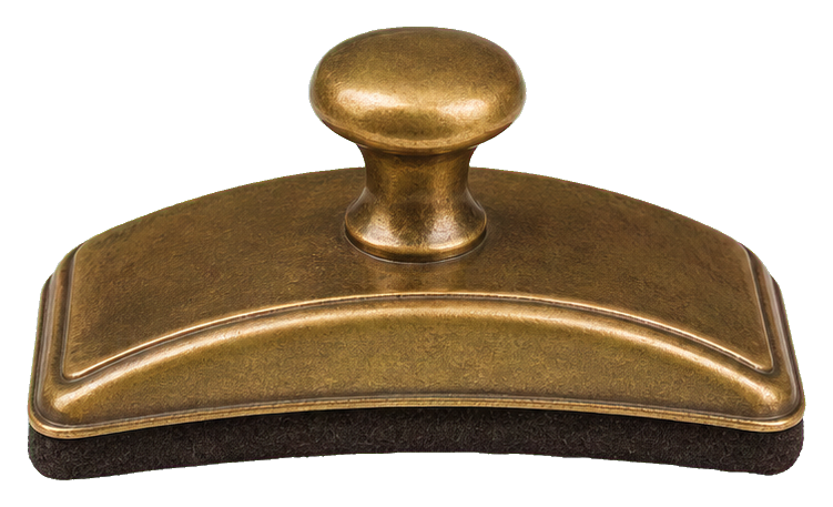 Antique brass ink blotter with a rounded handle and curved brass base