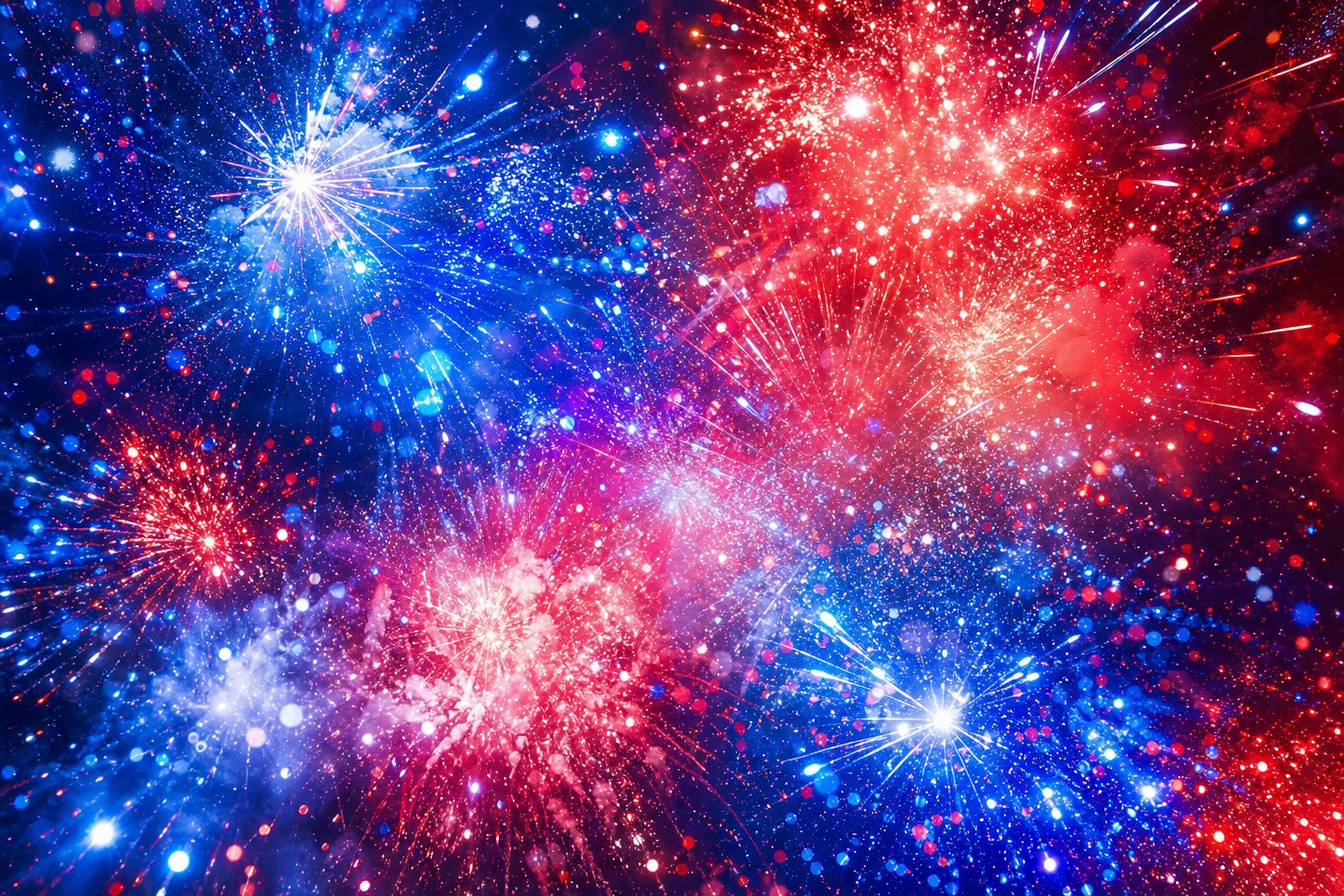 Abstract red, white, and blue fireworks bursting against a dark background