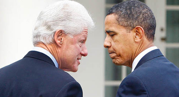 Bill Clinton and Barack Obama facing each other in conversation.