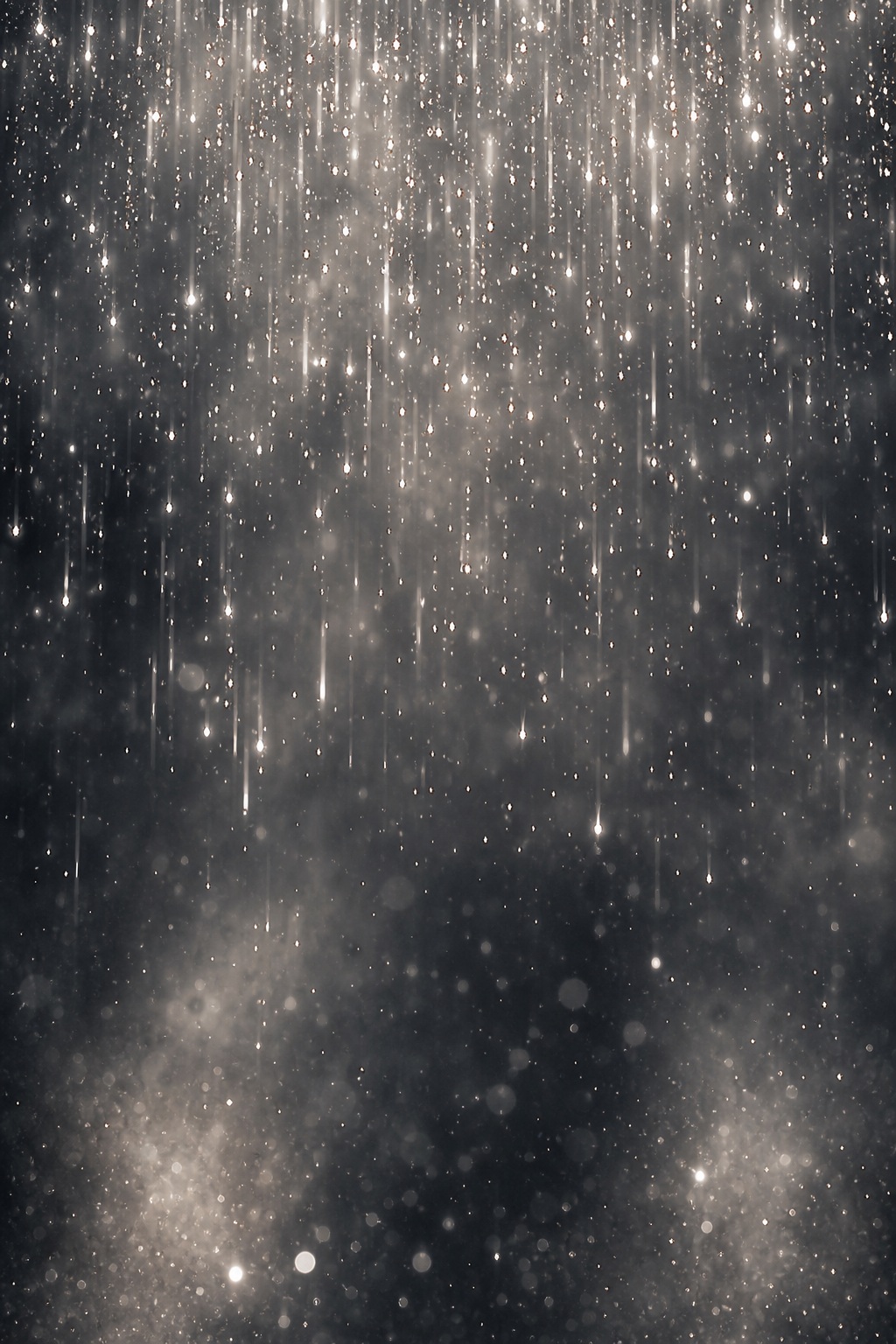 Abstract silver bokeh lights drifting over a dark textured background