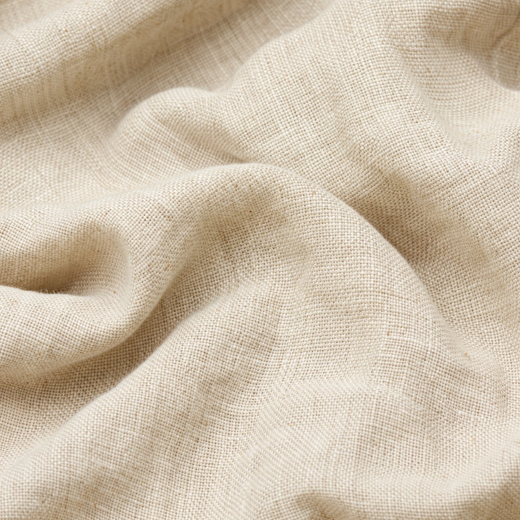 Soft beige linen fabric with visible woven texture and natural folds