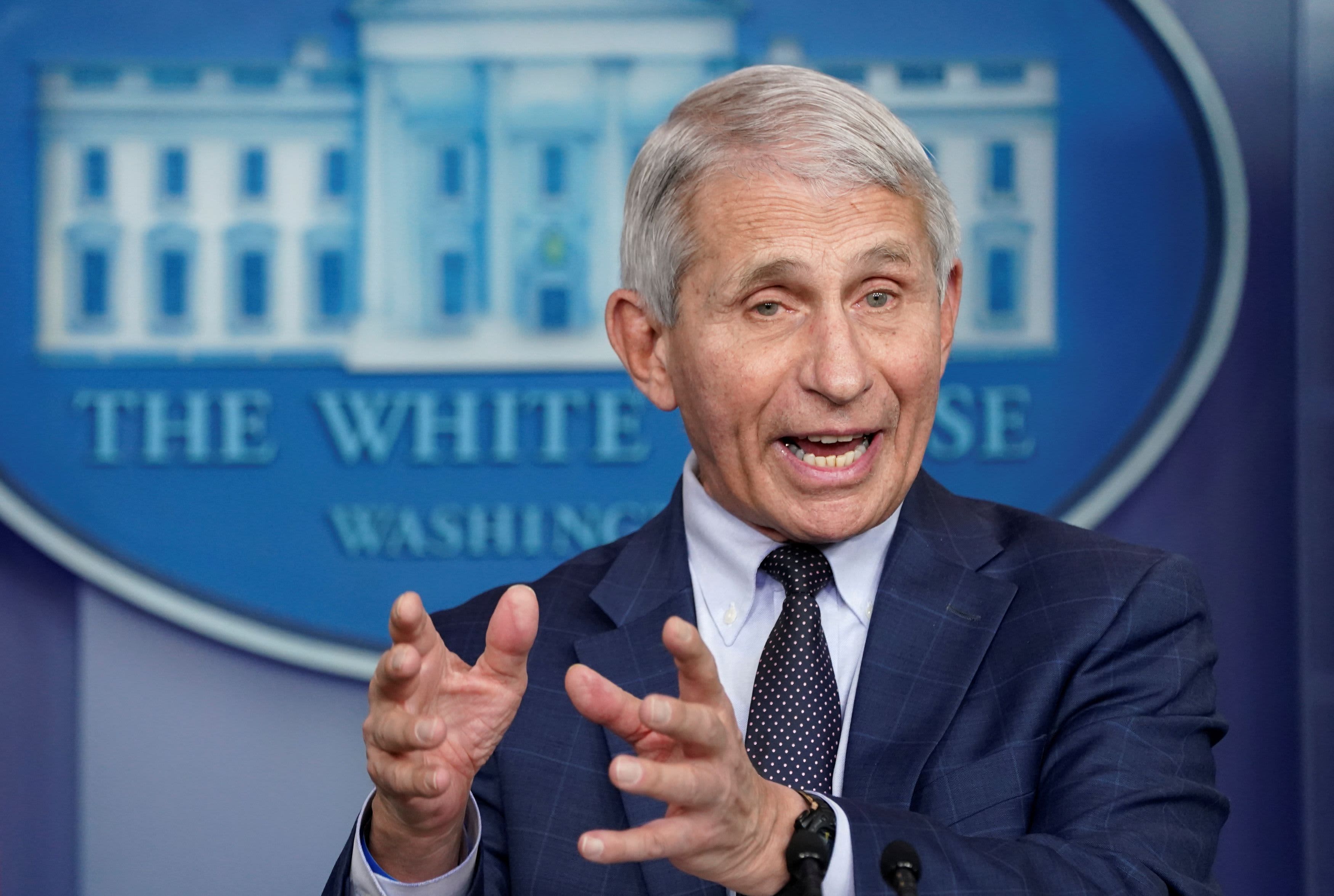 Dr. Anthony Fauci speaking in front of a White House backdrop and seal