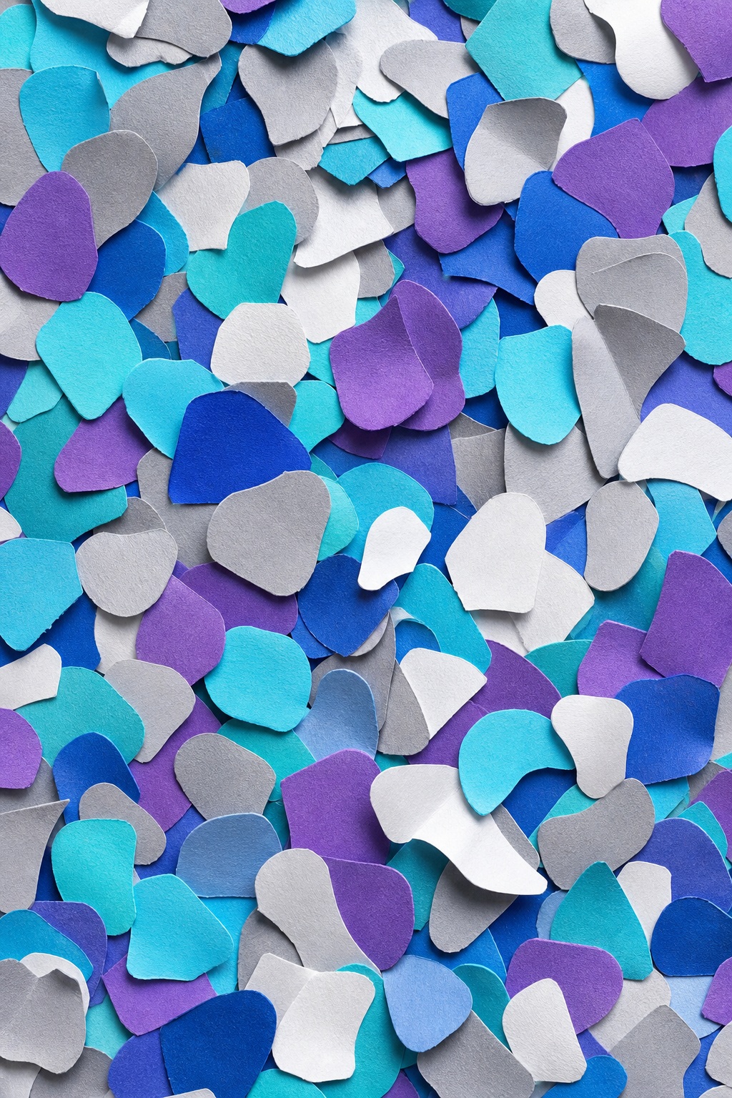 Colorful rounded paper confetti pieces layered over a textured dark background.