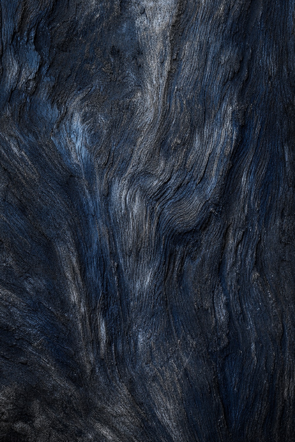 Dark blue-black weathered grain texture with flowing wood-like streaks