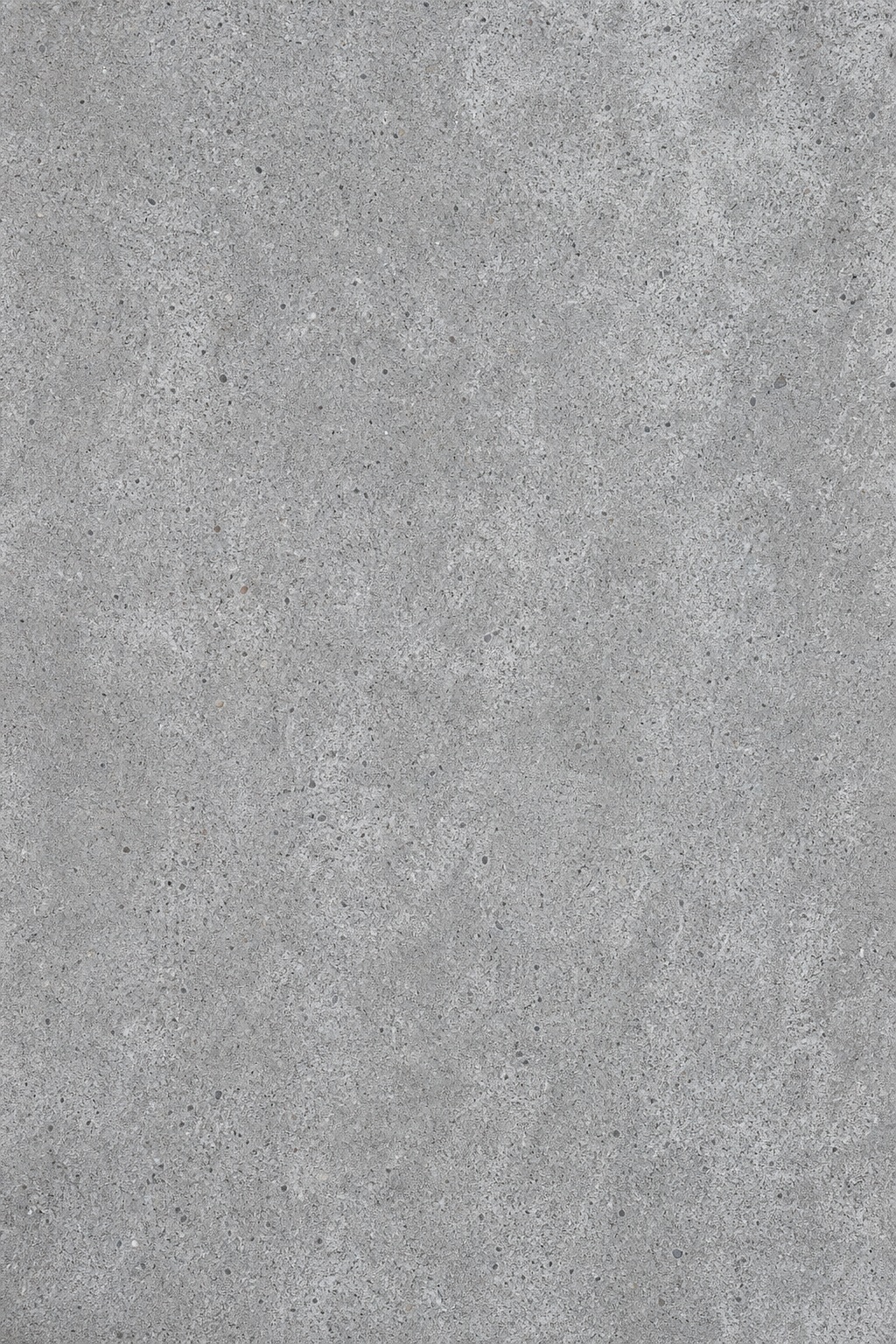 Vertical gray concrete texture with a rough, neutral surface