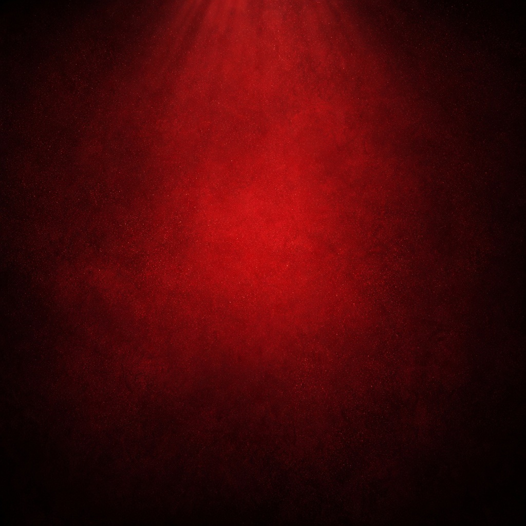 Soft red glowing spotlight with dark edges and subtle bokeh texture