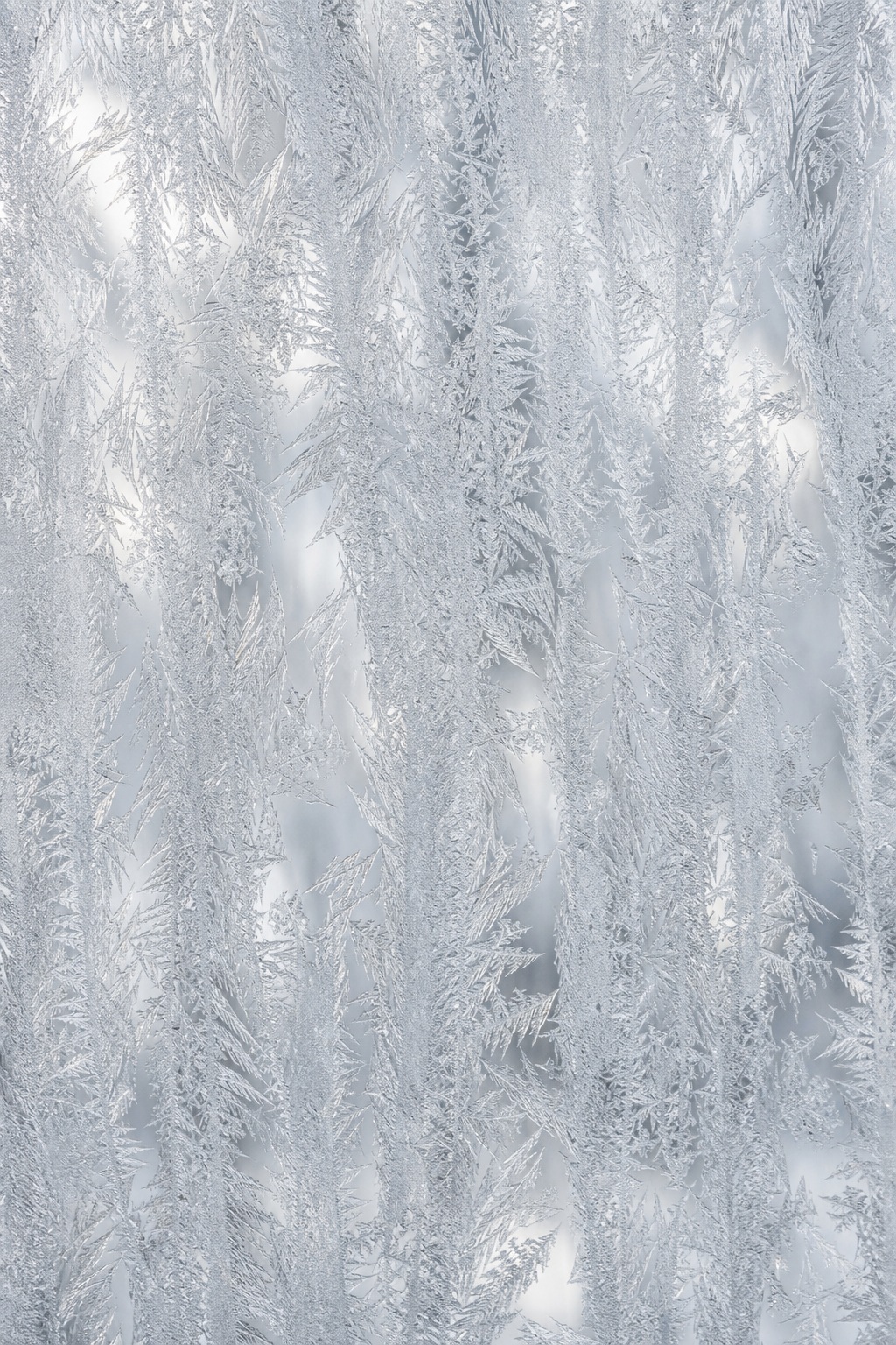 Vertical frosted glass texture with etched crystal-like patterns and a translucent matte finish