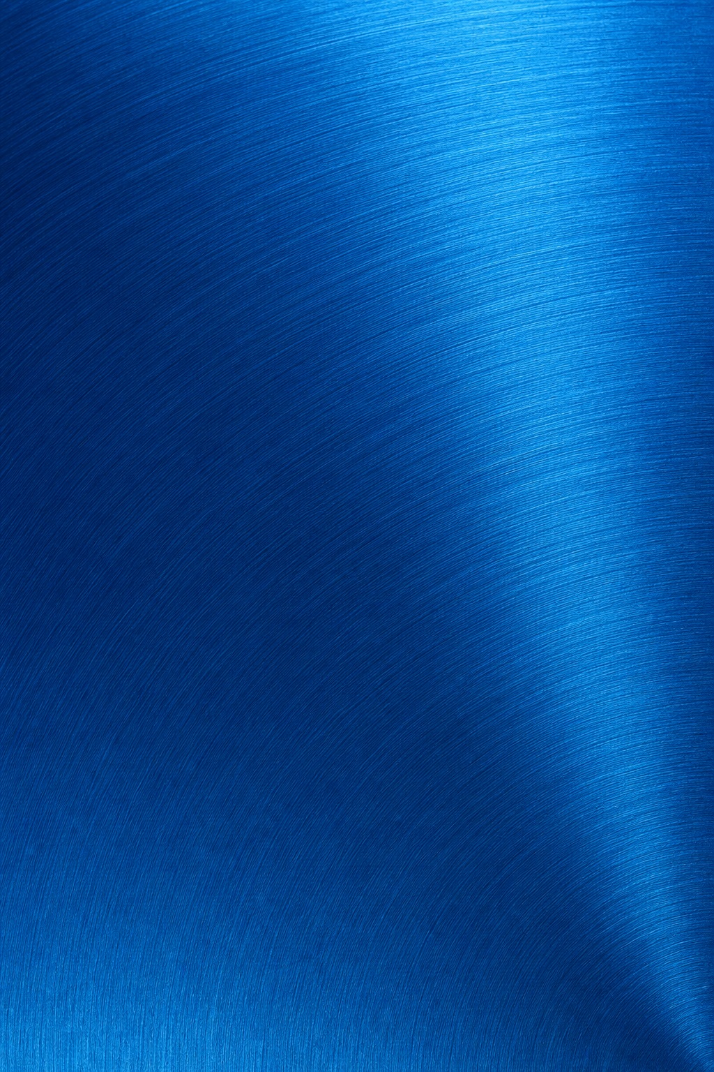 Blue brushed metal texture with curved radial grain and fine metallic lines