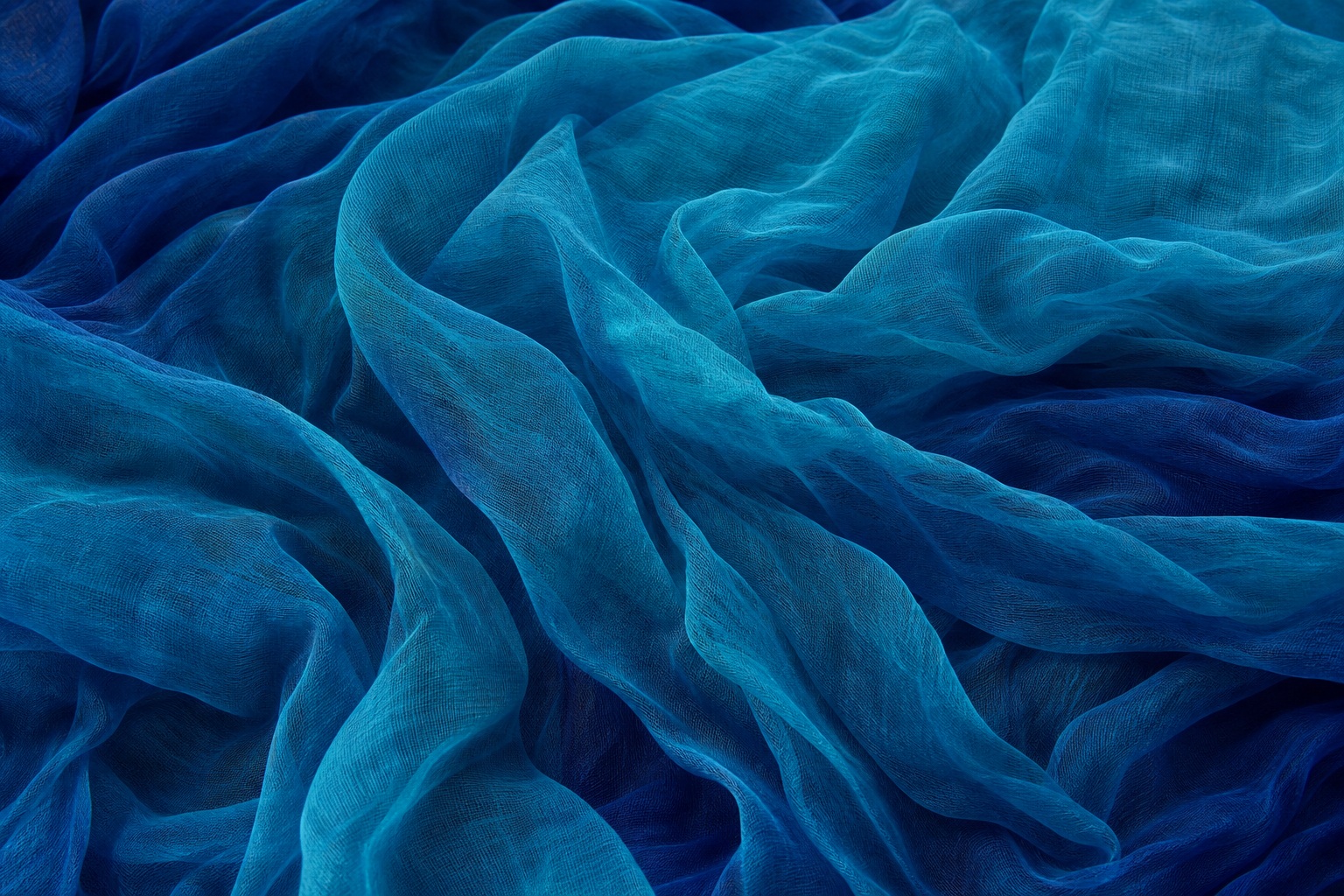 Cobalt teal layered gauze fabric folds forming a soft textured background