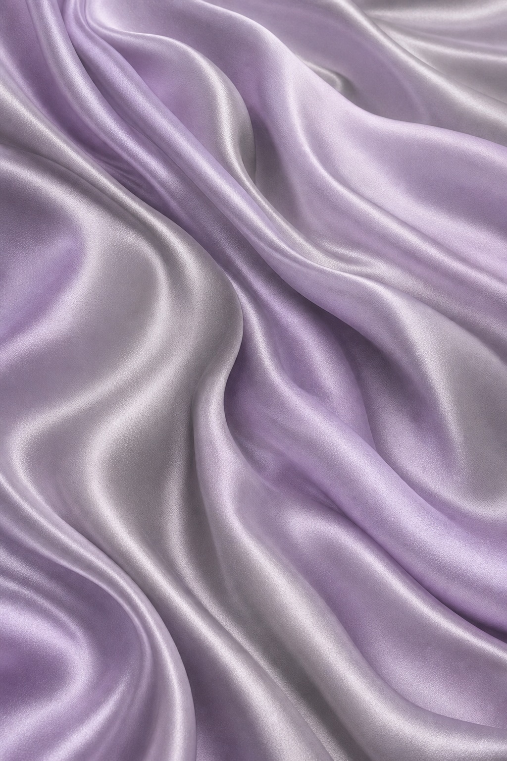 Lilac and silver silk fabric with broad flowing folds and a soft glossy texture