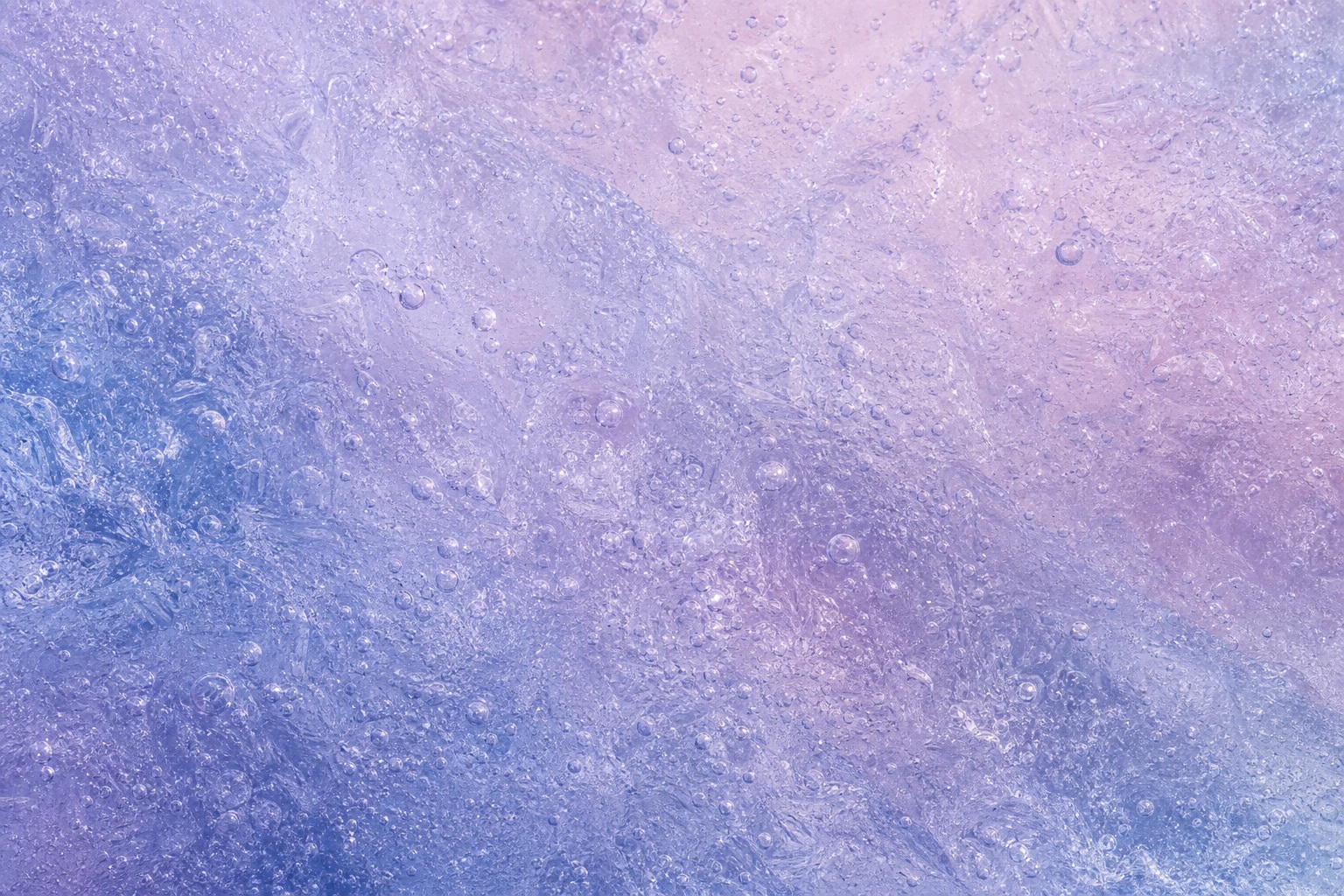 Violet and blue frosted ice surface with trapped air texture