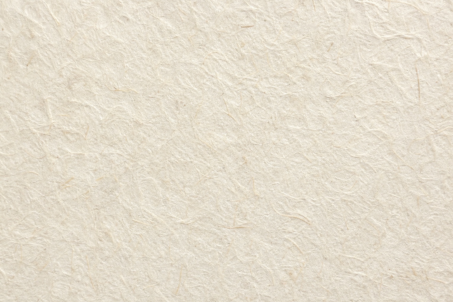 Light beige handmade cotton paper texture with subtle fibers and paper grain
