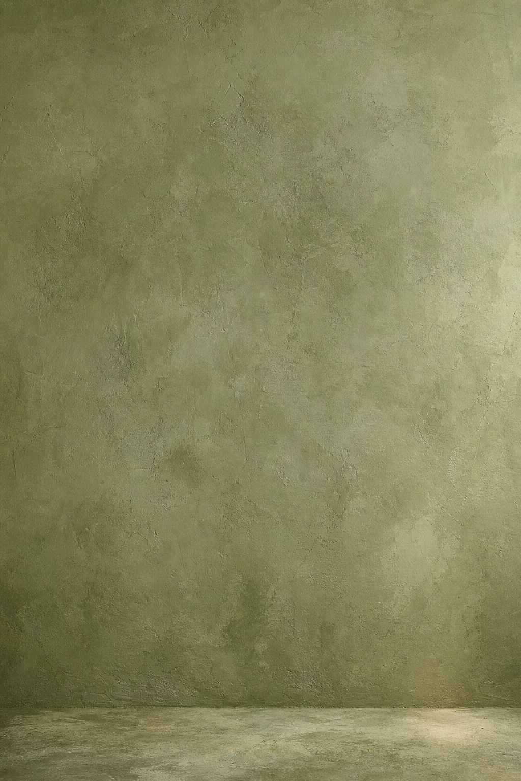Vertical olive plaster wall with a subtle studio floor and soft shadow.