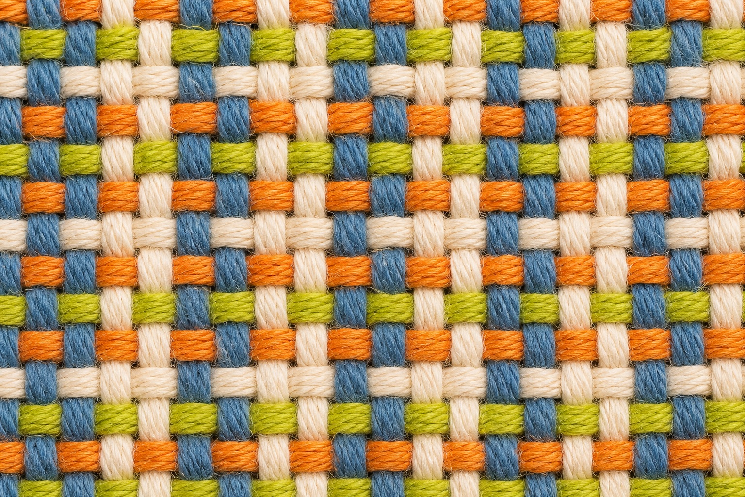 Colorful woven textile pattern with orange, green, yellow, and white threads