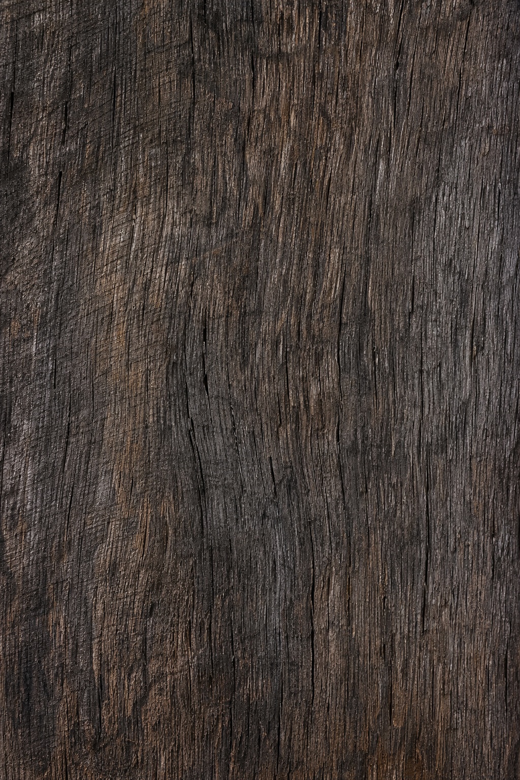 Dark weathered barn wood planks with rough vertical grain and aged texture