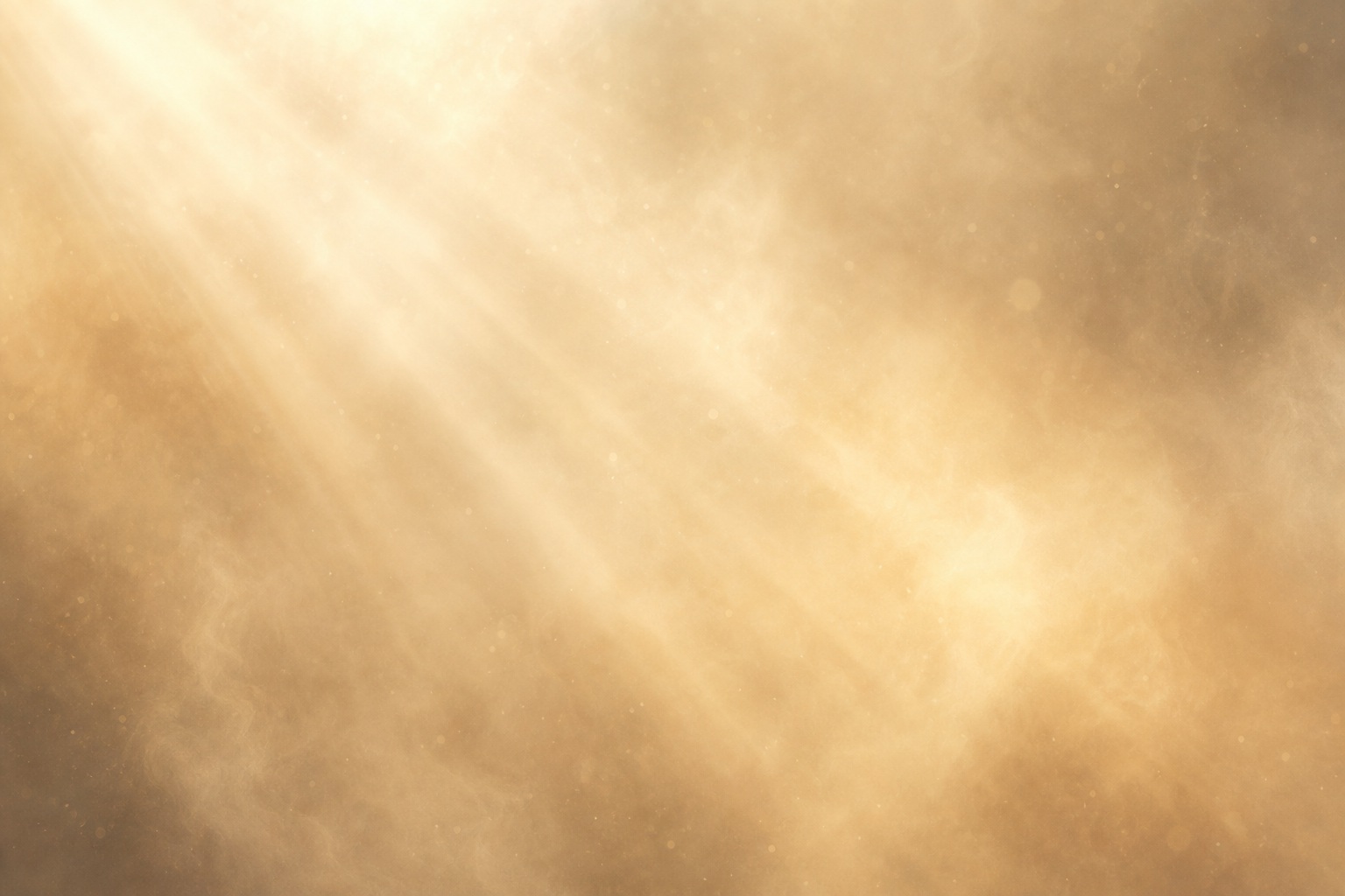 Golden sunbeams shining through a dusty hazy background