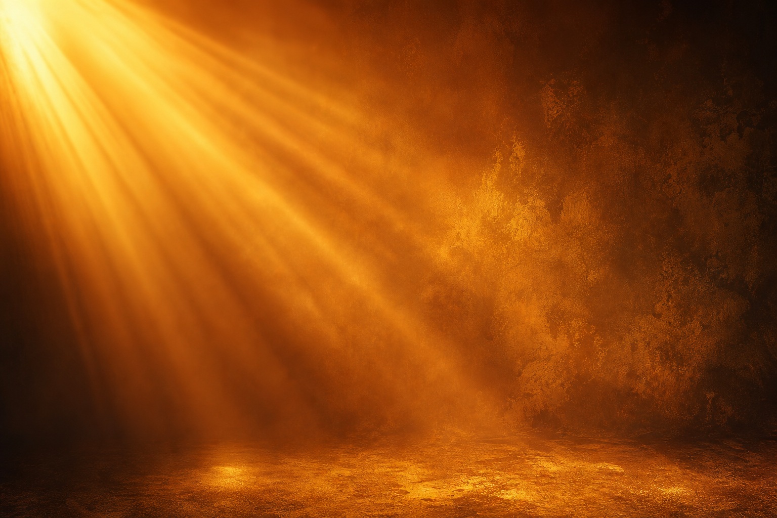 Warm amber light rays streaming through a dark studio with a soft glowing haze
