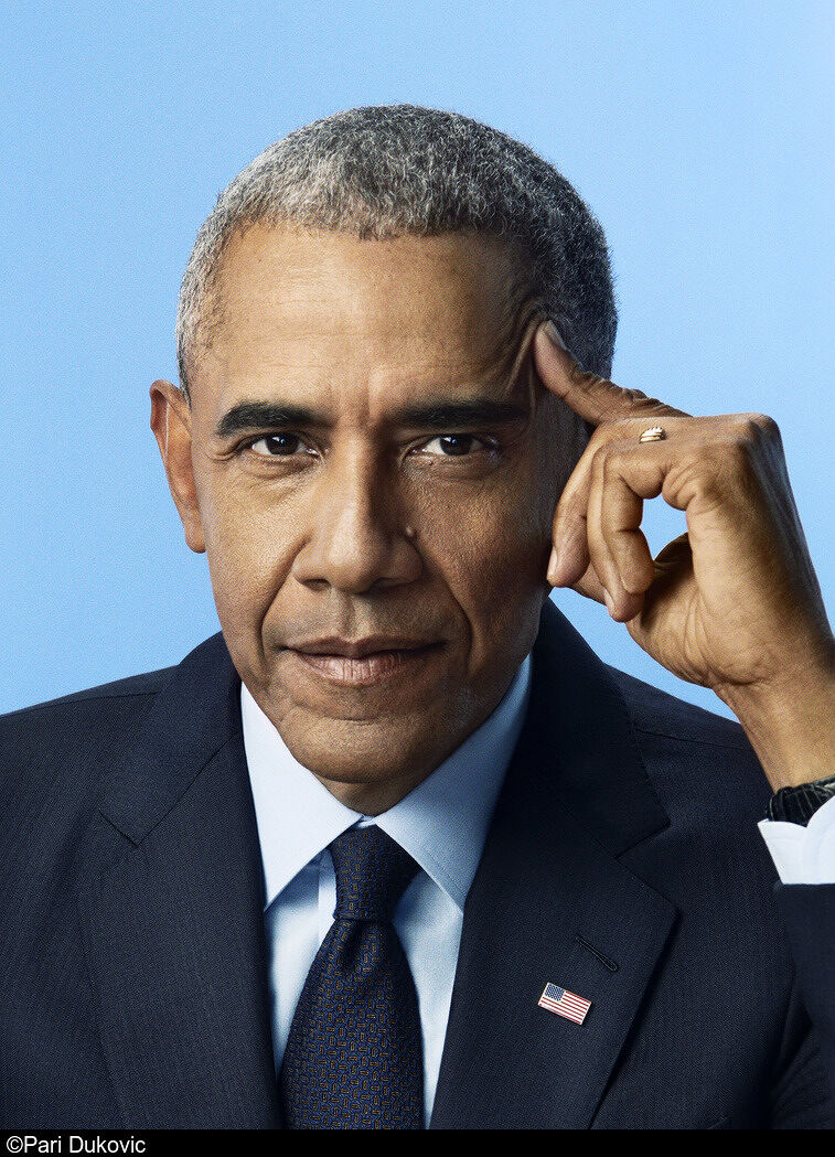 Formal portrait of Barack Obama in a suit against a blue background.