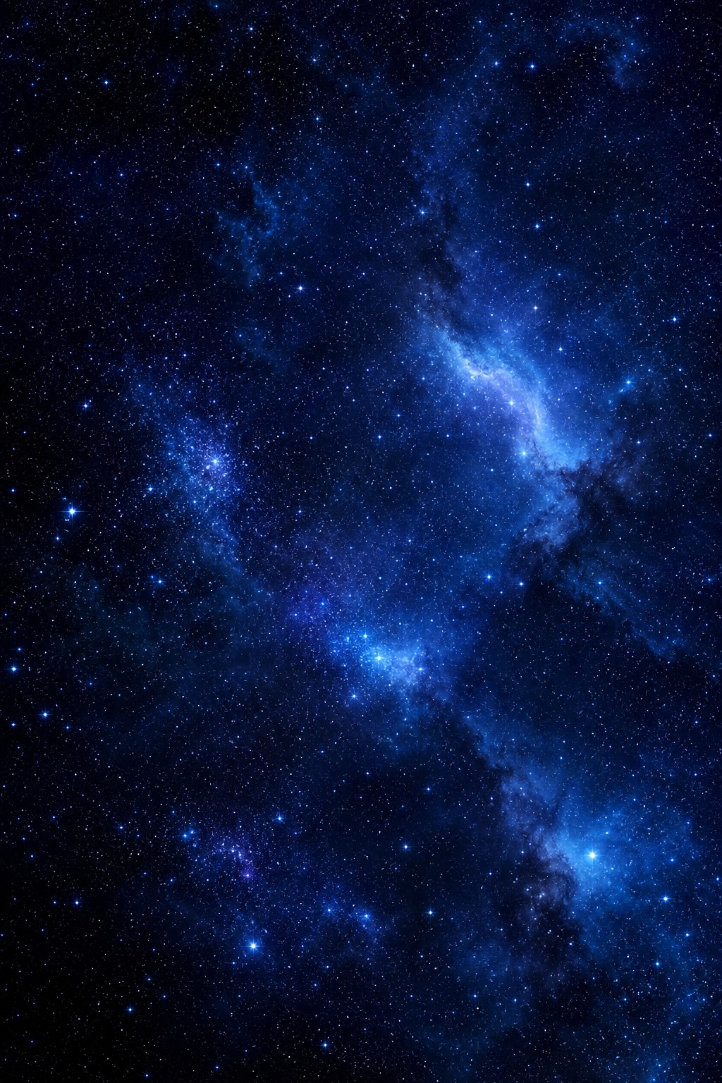 Deep blue star field with glowing nebula haze and scattered stars in a dark sky