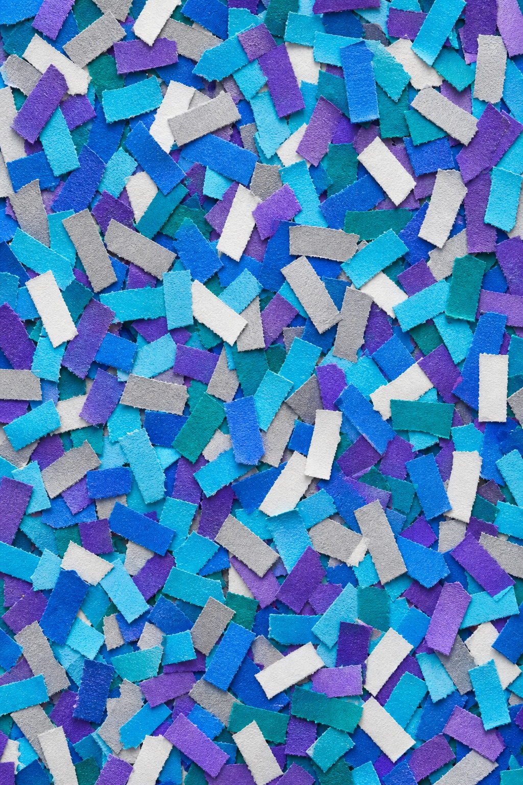Colorful paper confetti dashes scattered over a textured background.