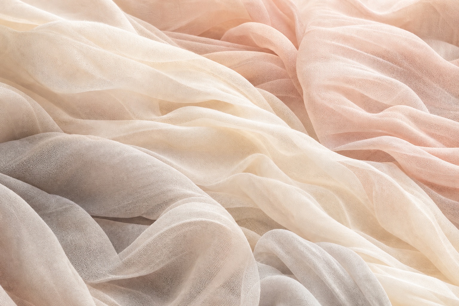 Soft ivory blush gauze fabric folds layered across the frame