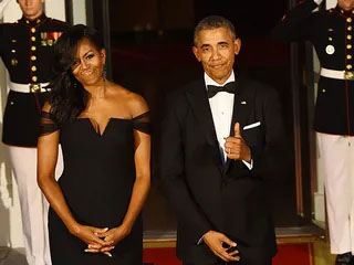 Barack Obama and Michelle Obama standing together at a formal event