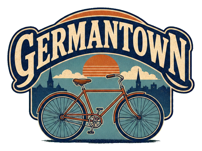 Illustrated Germantown word art above a bicycle with a sunset background