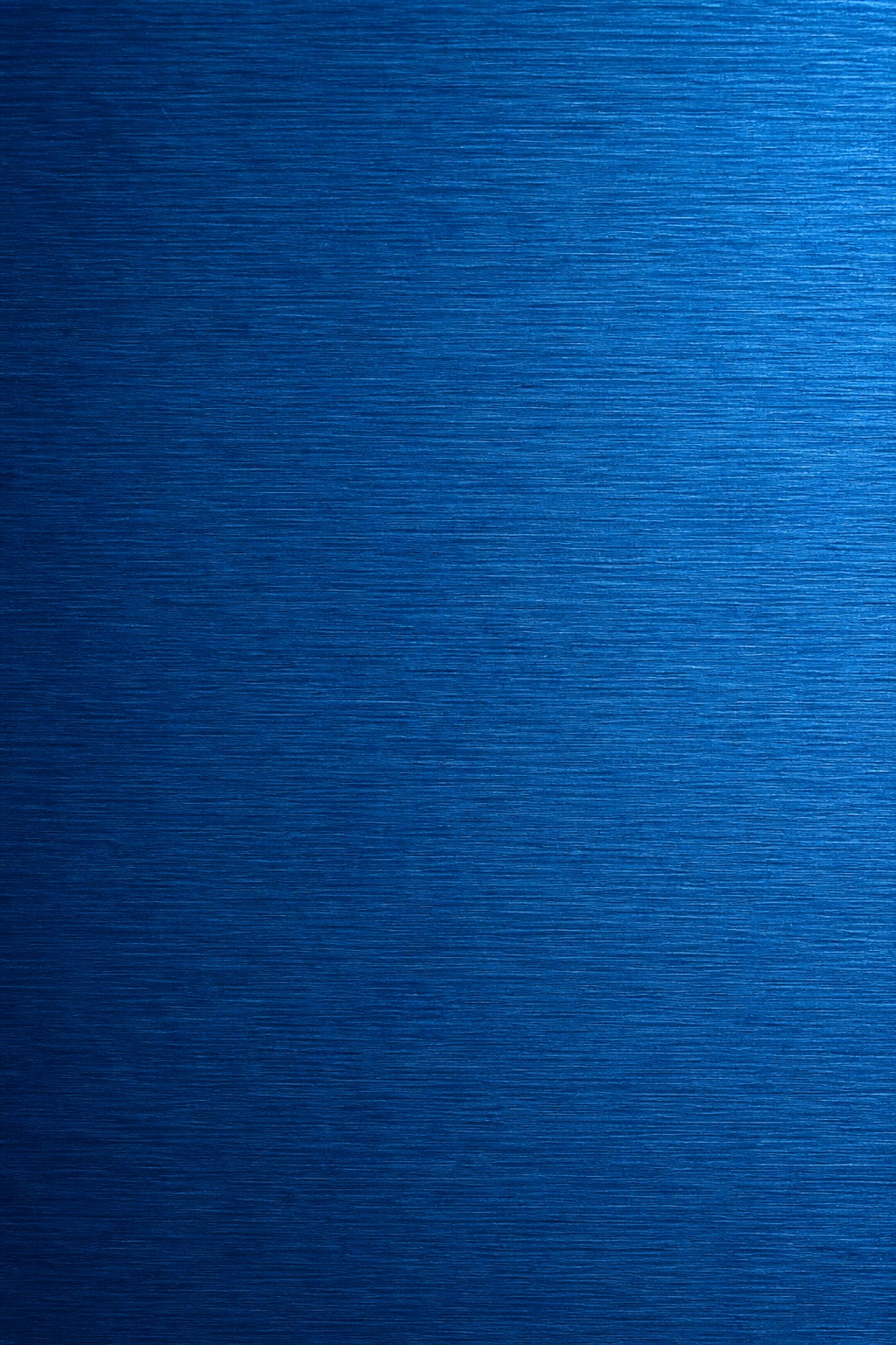 Blue anodized brushed metal surface with fine horizontal horizontal grain.
